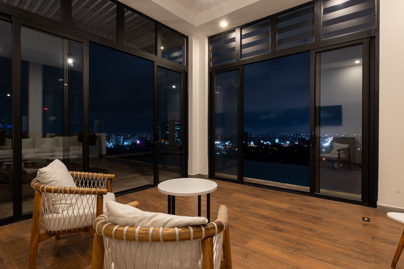 Final photo: Lounge with floor-to-ceiling windows