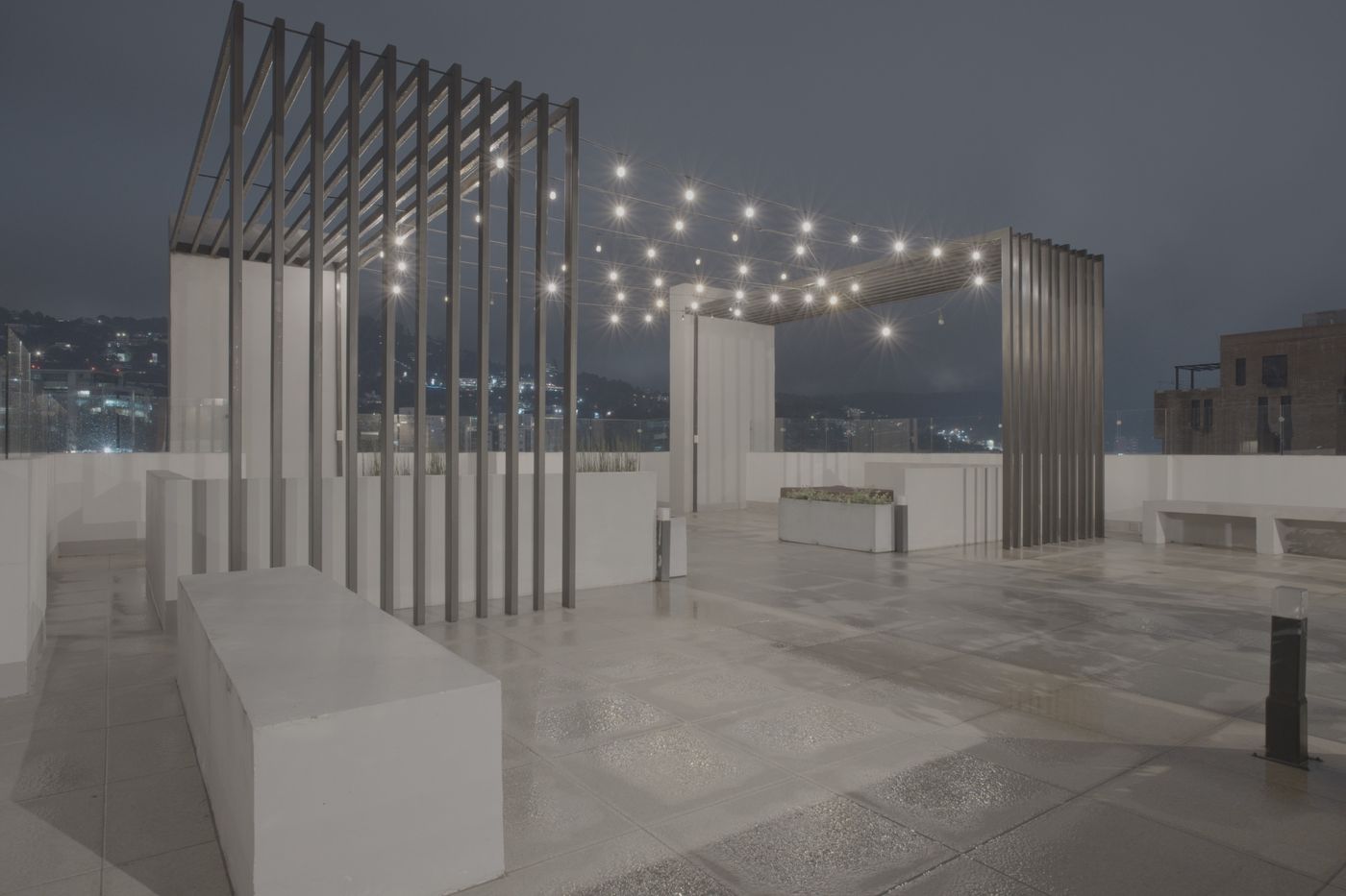Flat unedited image: Terrace with a pergola and string lights