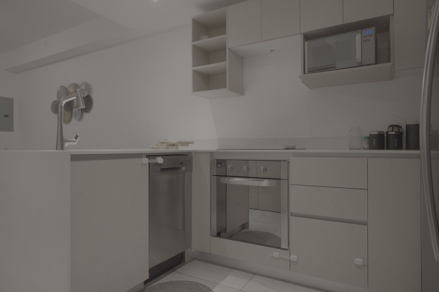 Flat unedited image: Kitchen with light finishes and stainless appliances