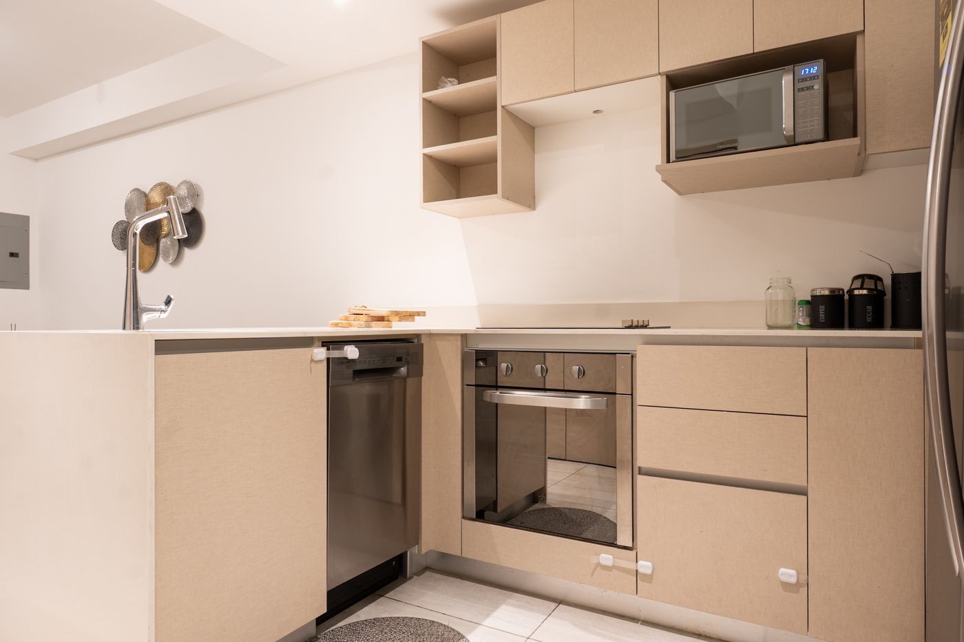 Final photo: Kitchen with light finishes and stainless appliances