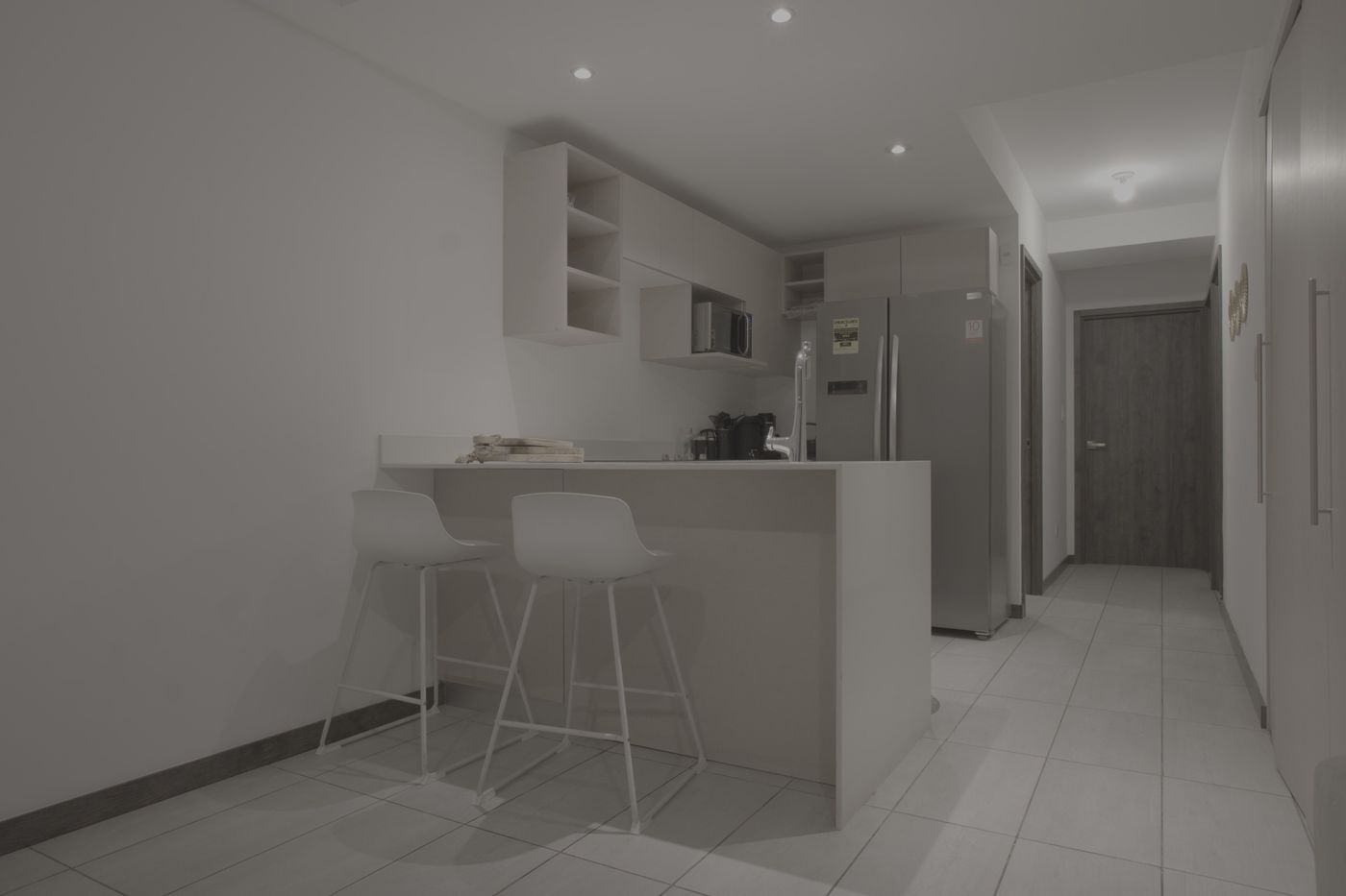 Flat unedited image: Kitchen bar with tall stools