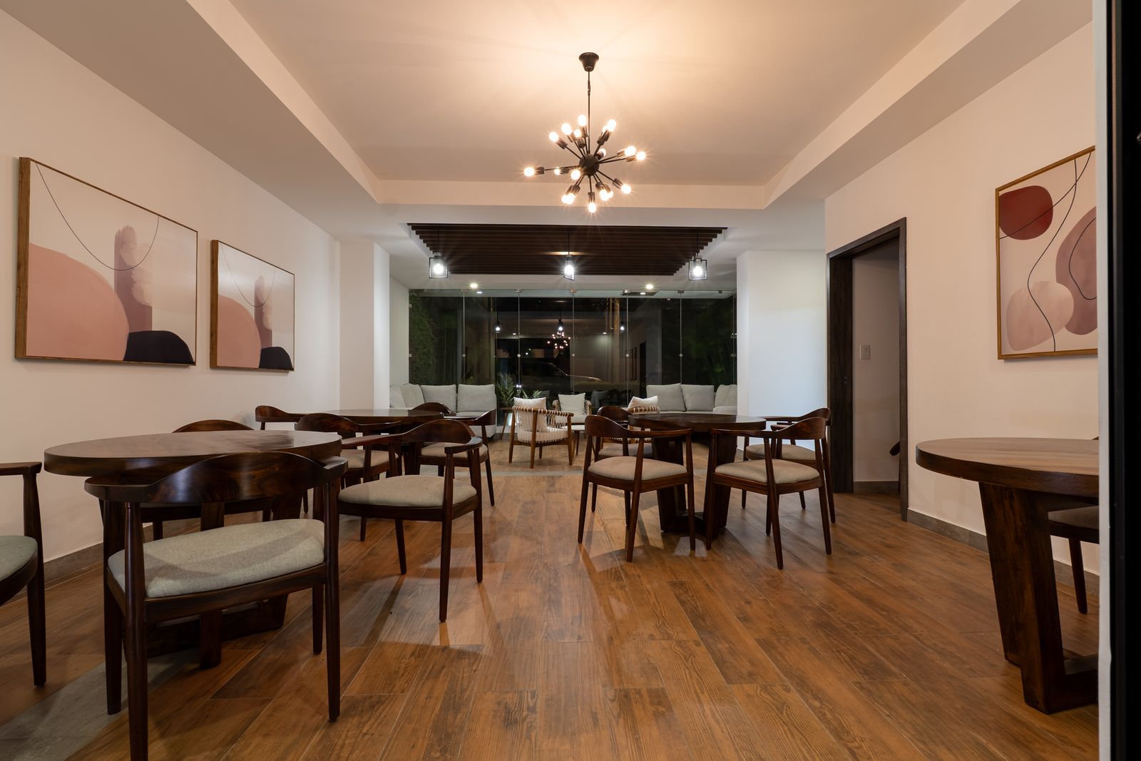 Social room dining area with a central light fixture