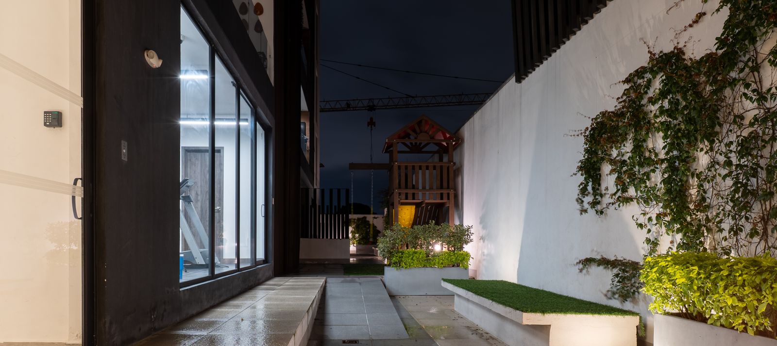 Outdoor walkway with lit planters