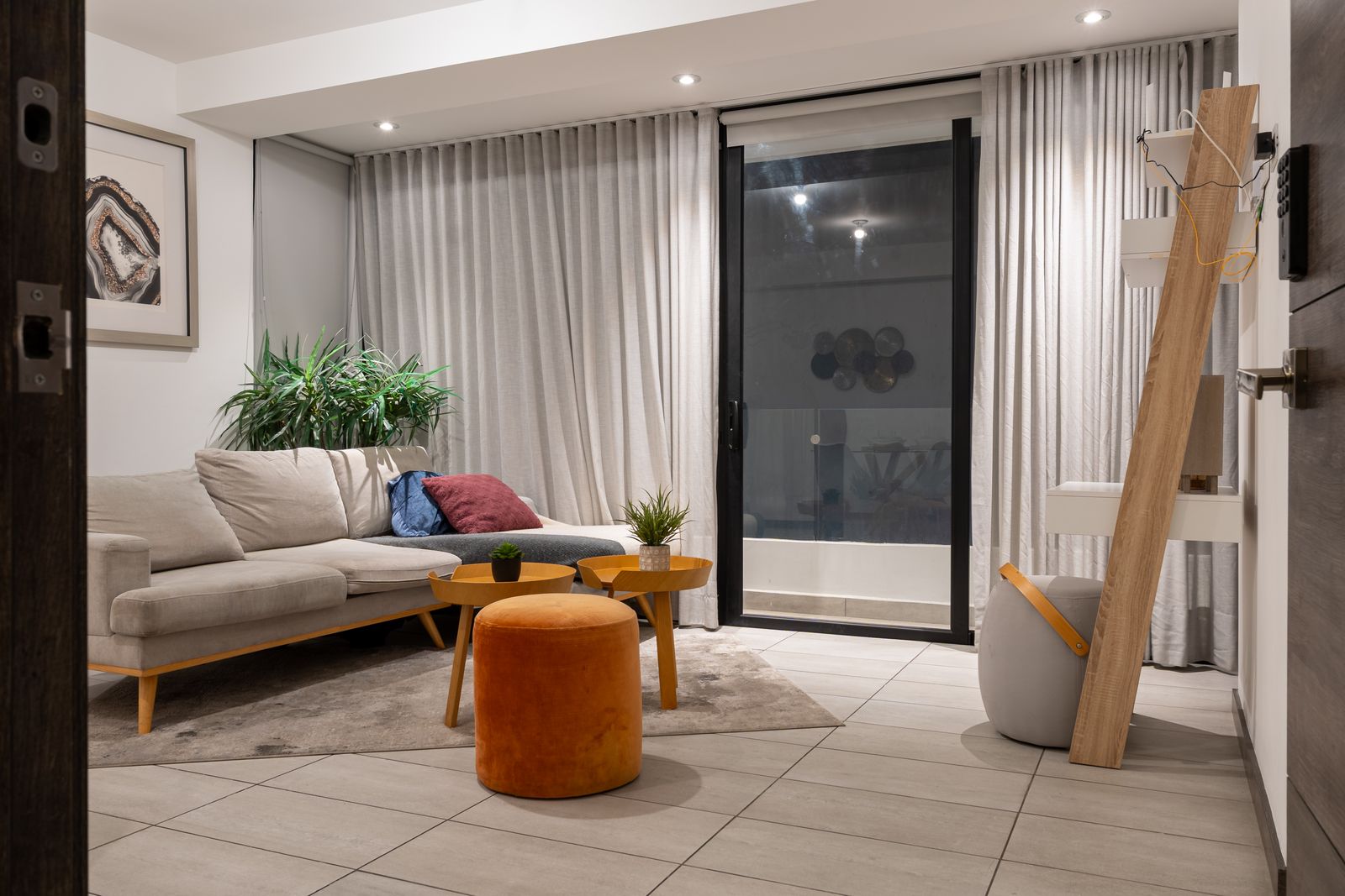 Living room with curtains and a large window